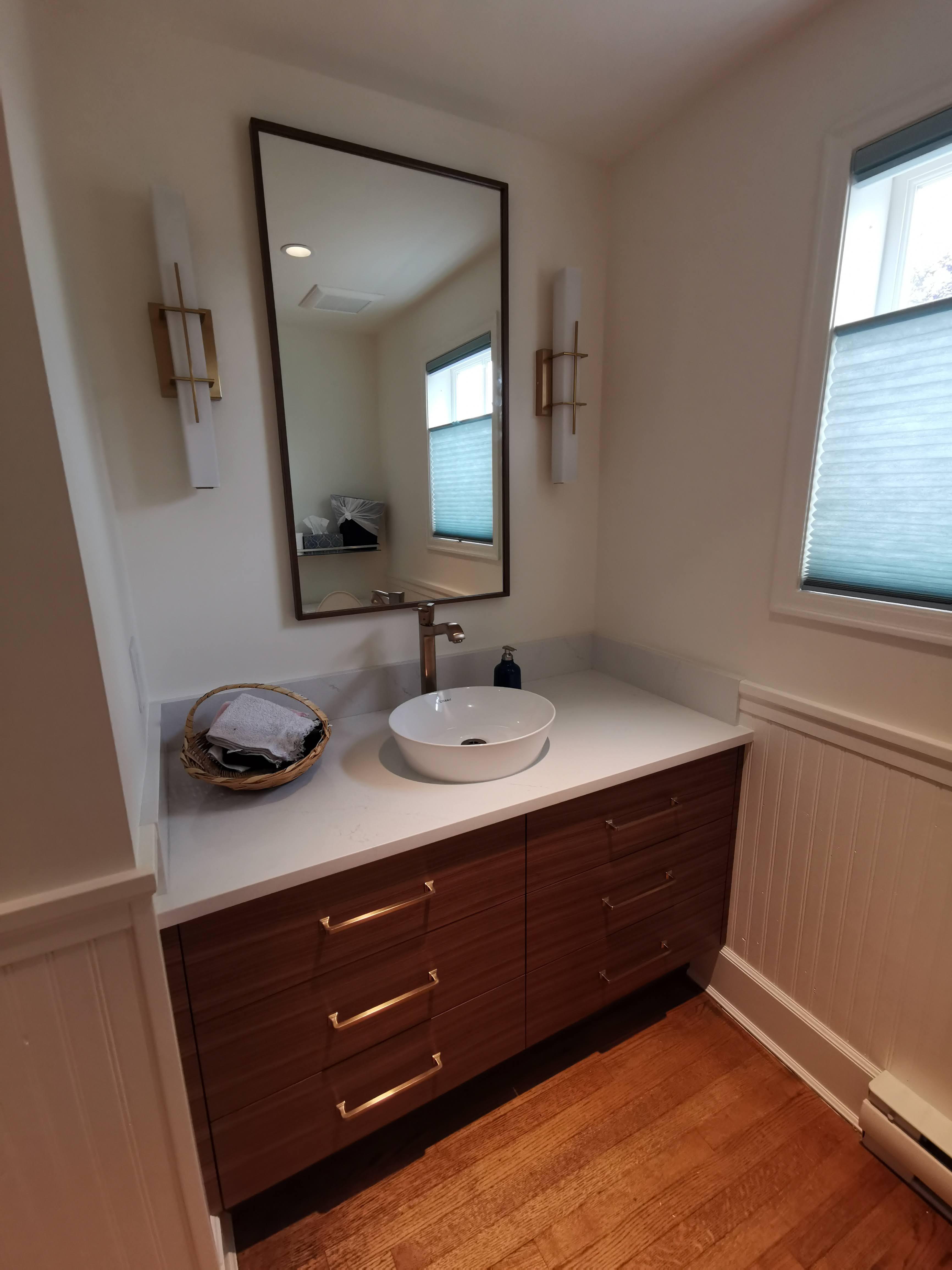 Grain matched walnut drawer fronts, crisp white counter.