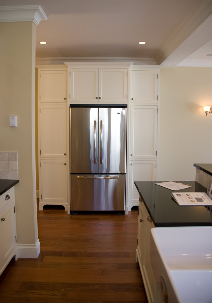 Built-in refrigerator surround with full-height cabinetry