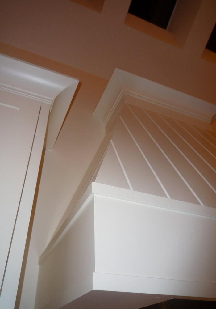 Custom grain-free painted range hood — smooth finish, no visible wood grain
