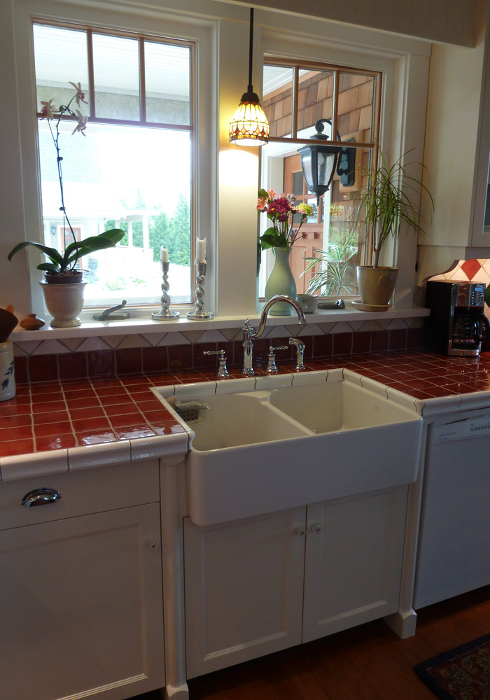 Face-frame cabinets with glass uppers and painted finish