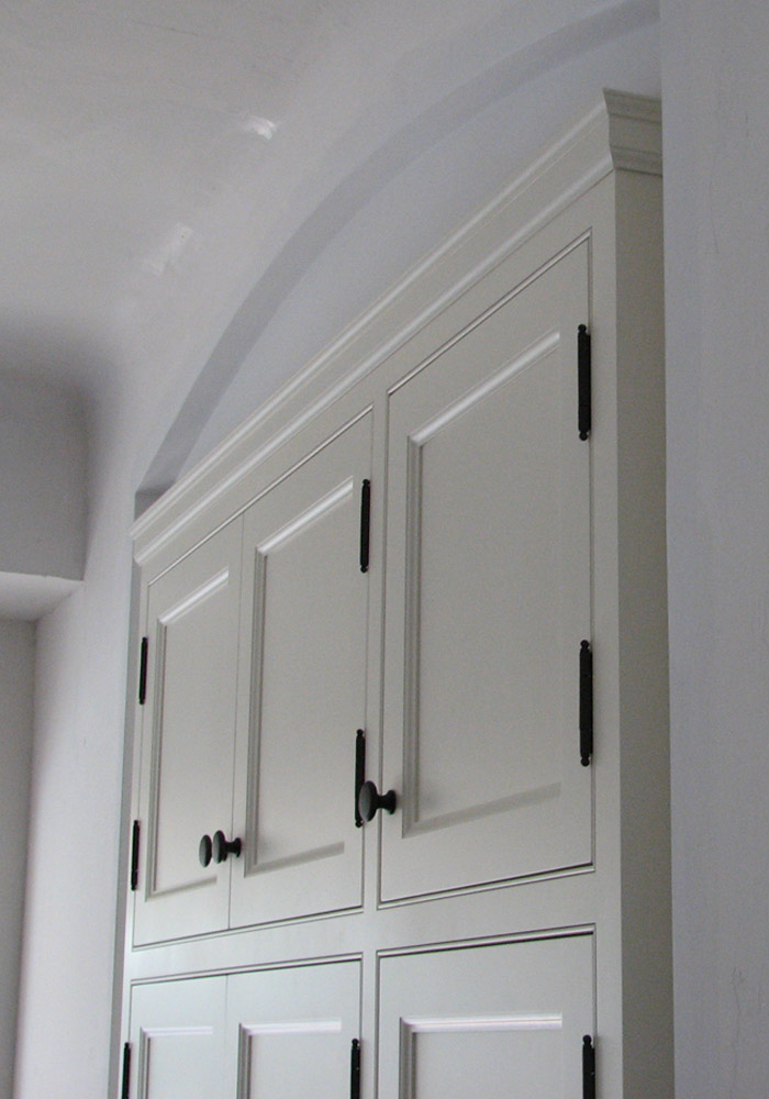 Traditional face-frame kitchen, painted white with crown moulding
