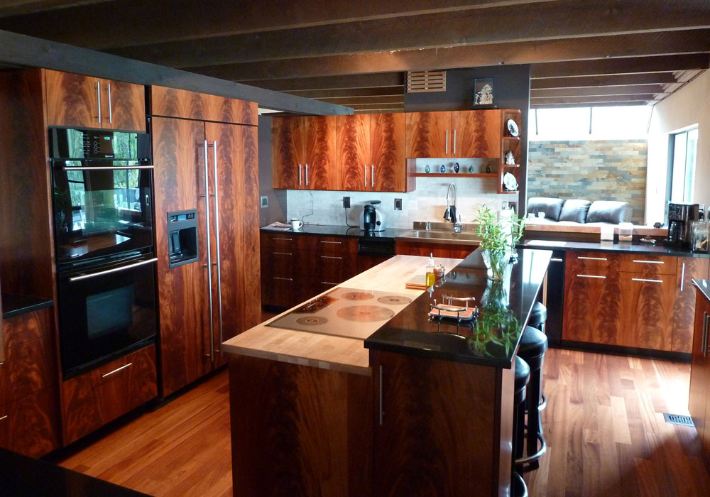 Full crotch mahogany frameless kitchen with island and exposed beam ceiling
