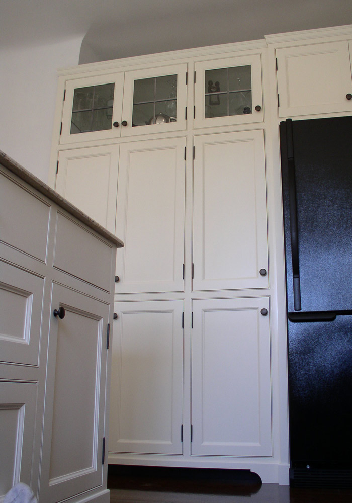 Traditional face-frame kitchen, painted white with crown moulding